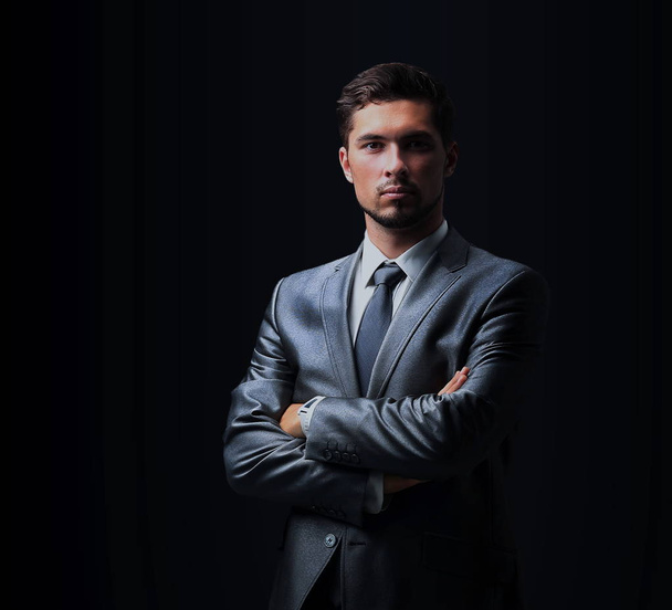 Handsome businessman isolated on black - Foto, immagini
