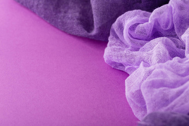 Purple background with violet colored gauze fabric. Fashion back - 写真・画像