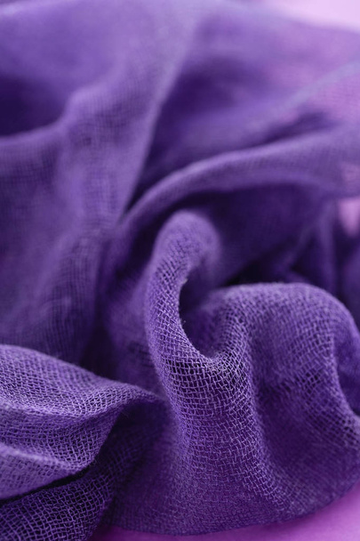 Closeup of hand dyed gauze fabric purple color. Ultra violet tre - Photo, image