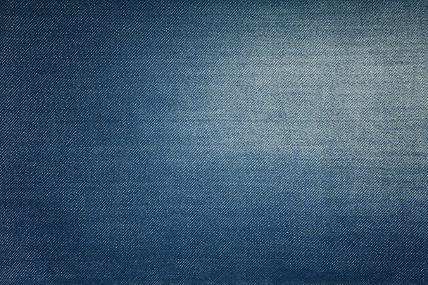 Blauwe jeans van gewassen denim textuur achtergrond - Foto, afbeelding