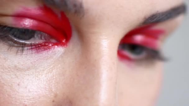 Close-up of beautiful female eyes with bright make-up - Felvétel, videó