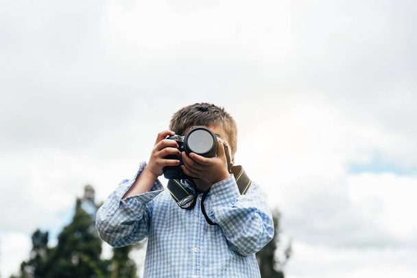 Little kid photographing with his camera. - Foto, Imagem