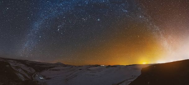 Night panorama of the sunset with the milky way in the Caucasus in winter - Fotó, kép