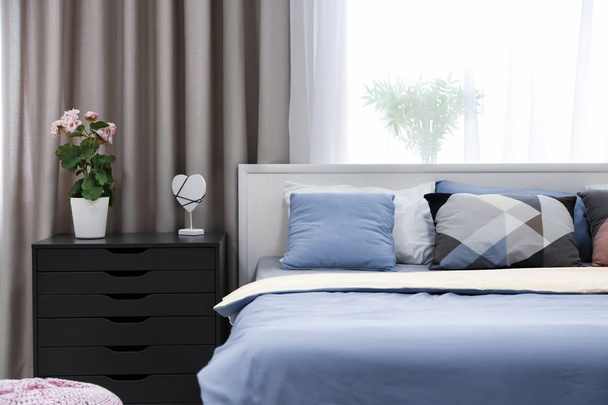 Modern bedroom interior with comfortable bed - Zdjęcie, obraz