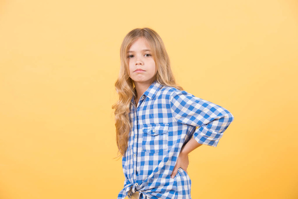 Kid girl with blond long hair in blue plaid shirt - Фото, зображення