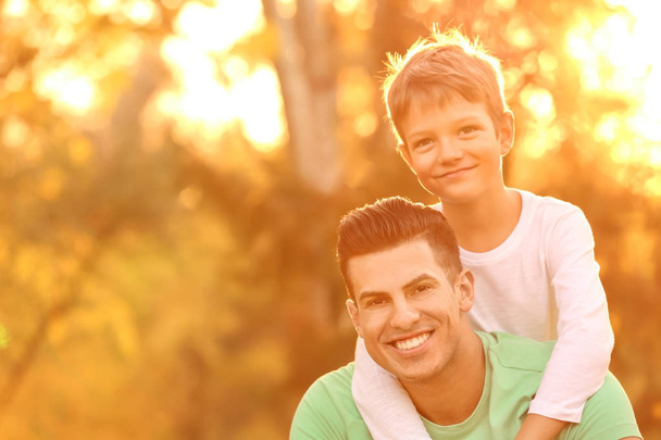 Father and his son outdoors on sunny day - Photo, image