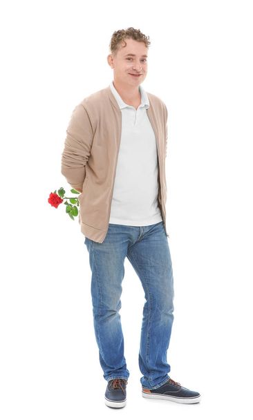 Handsome mature man with red rose, isolated on white - Foto, Imagen