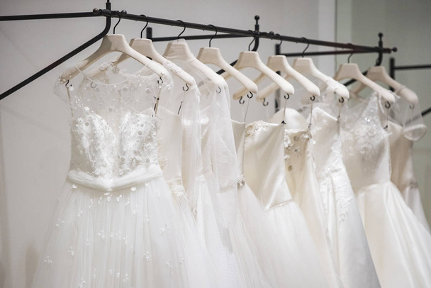 Wedding dresses in a store - Фото, изображение