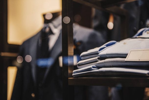 Shirts and suits in a men luxury store - Foto, afbeelding