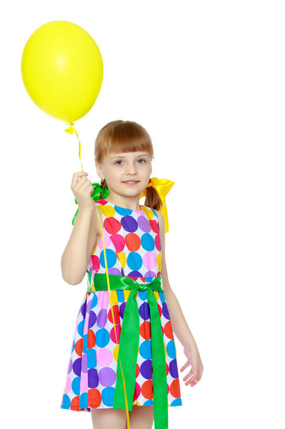 Little girl with a balloon. - Zdjęcie, obraz