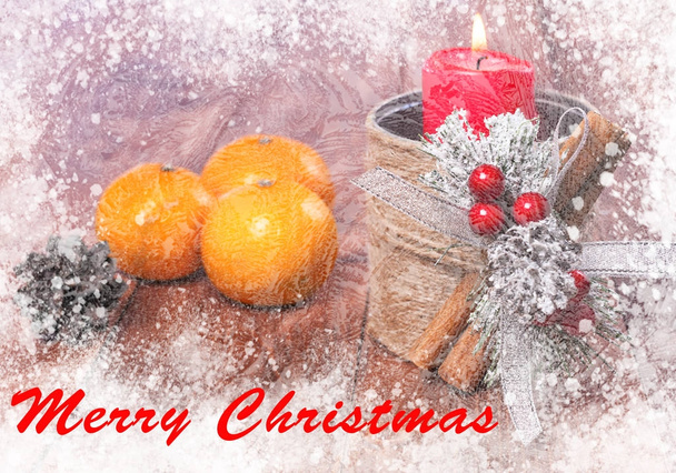 Christmas card with a candle and tangerines.  - Фото, изображение