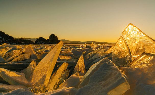 View on and throug ice during sunset on Lake Baikal. Russia, Siberia - Foto, imagen