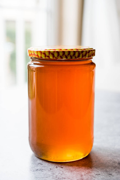 Honey in Jar with Lid. Copy Space. - Фото, изображение
