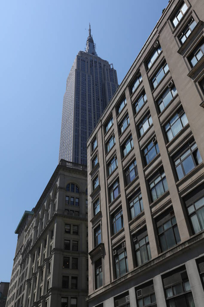 Grey skyscrapers on blue sky background. America, New York City - May 7, 2017 - 写真・画像