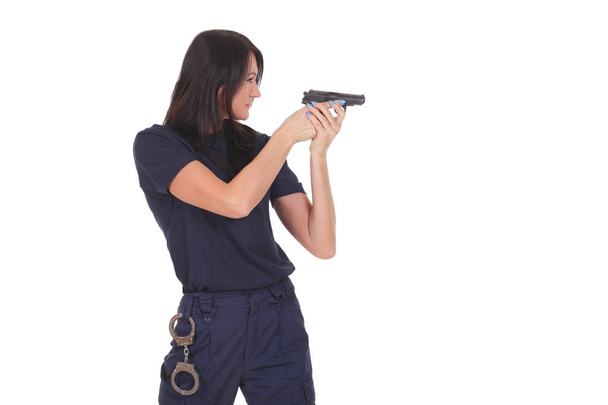 young police girl with gun - Foto, afbeelding