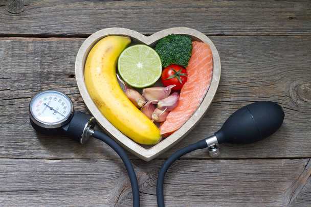 Health heart diet food concept with blood pressure gauge - Photo, Image