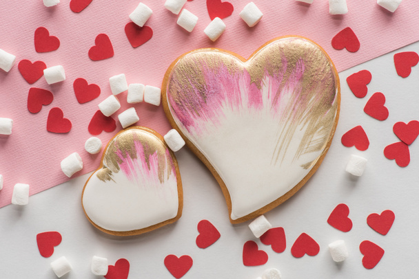 close up view of heart shaped cookies, sweet marshmallow and confetti, st valentines day concept - Photo, Image