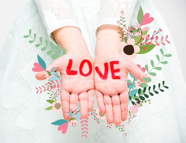 Word love written on palms - Фото, зображення