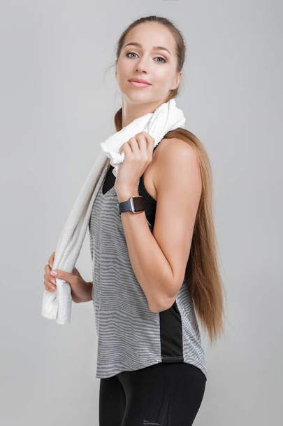 athletic woman with towel after workout - Zdjęcie, obraz
