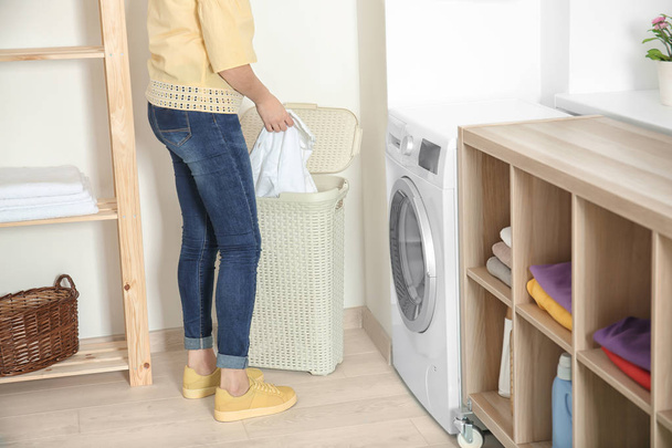Woman doing laundry at home - Foto, Bild