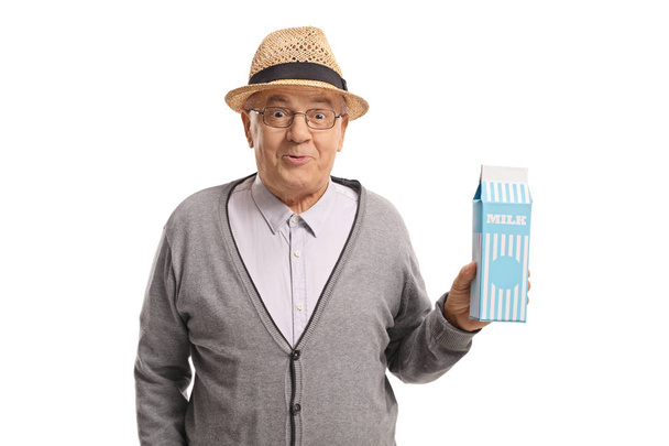 Mature man holding a carton of milk - Fotografie, Obrázek