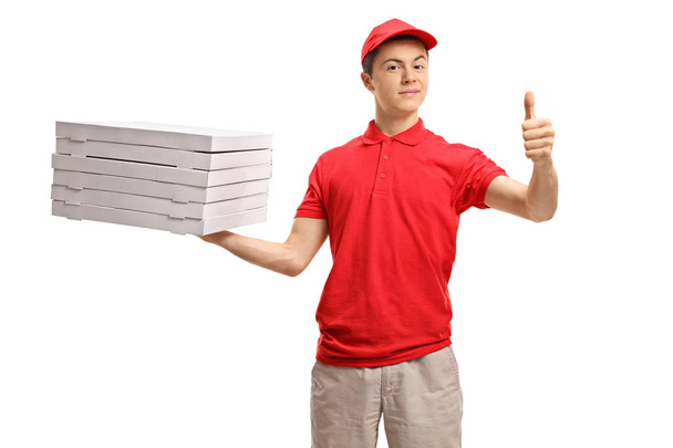 pizza delivery boy making a thumb up sign  - Фото, изображение