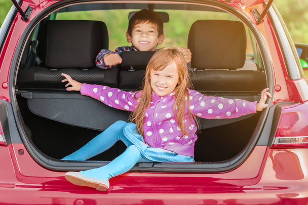 Cute children in modern car - Foto, Imagen