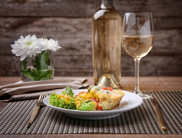 Plate of tasty baked Brussels sprouts with cheese on table - 写真・画像