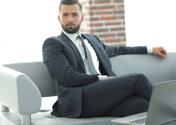Portrait of a successful businessman sitting in the office lobby. - Photo, Image