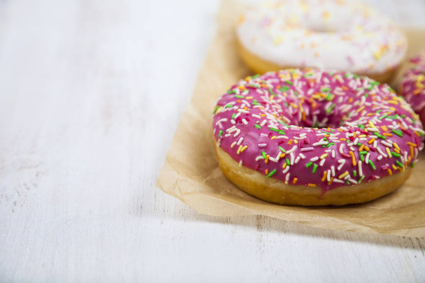 Pink donuts on paper  - Foto, afbeelding