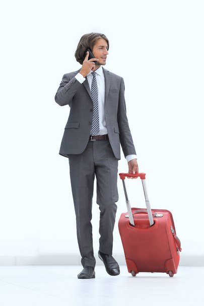 successful businessman with Luggage talking on the phone. - Photo, image