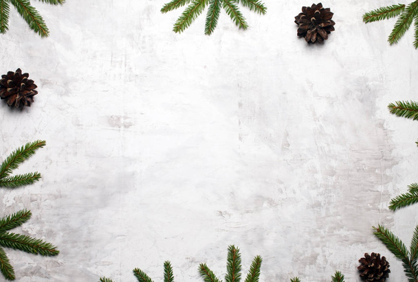 Christmas background with fir branches and fir cones. Christmas wallpaper. Christmas, New Year's composition with copy space for text. Flat lay, top view - Photo, Image