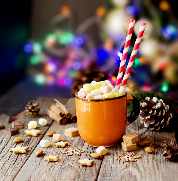 a cup of Christmas hot cocoa with marshmallow New Year's lights and decorations, selective focus - Foto, Imagen