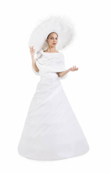 Girl in white long dress and big hat. - Фото, изображение