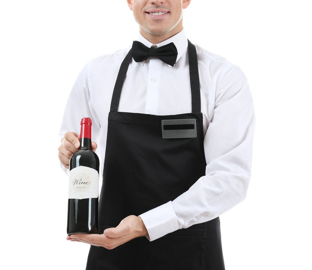 Waiter holding bottle of wine on white background - Фото, изображение