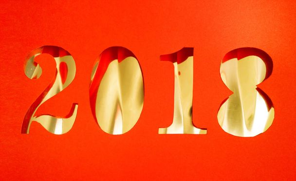 2018 new year cut from red paper on gold background - Zdjęcie, obraz