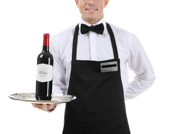 Waiter holding tray with bottle of wine on white background - Foto, afbeelding