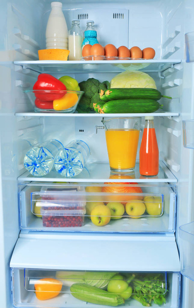 Refrigerator with fresh products, closeup - Фото, изображение