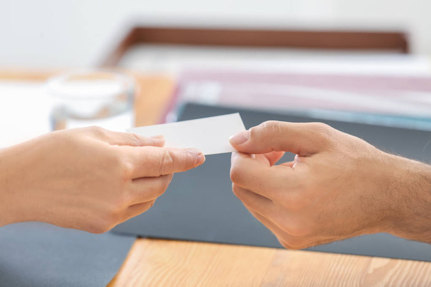 Notary giving business card to client in office - 写真・画像