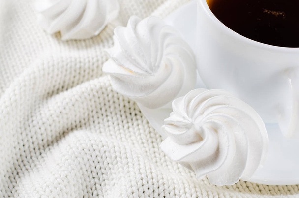 Delicious meringue cookies and cup of hot tea. - Photo, Image