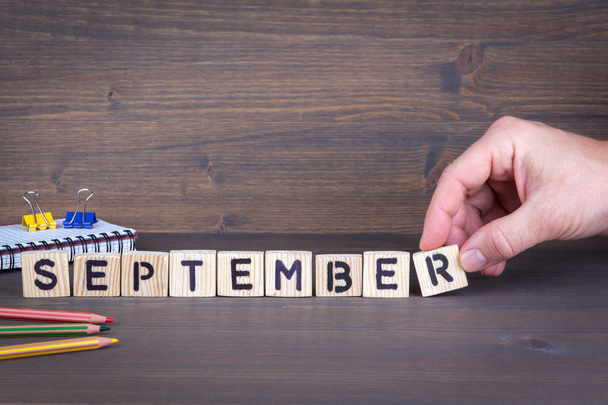 september. Wooden letters on the office desk, informative and communication background - Photo, Image