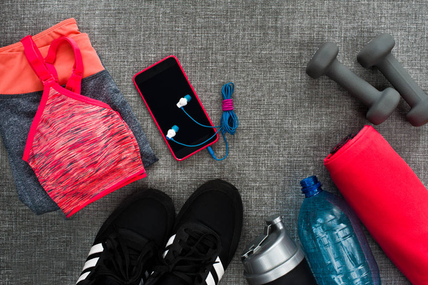 Sport concept - background, flatlay of sport, gym equipment, woman workout. Text space - Photo, Image