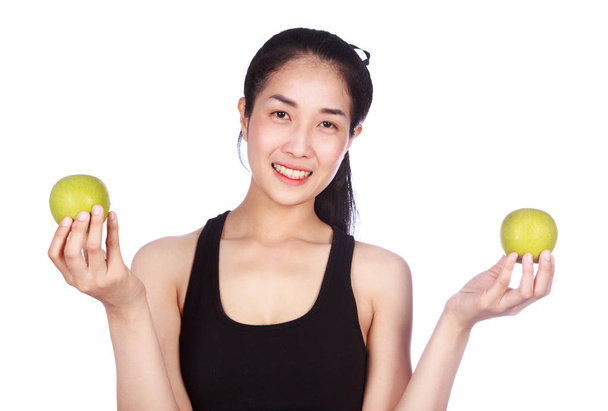 fitness woman with green apple isolated on white background - Фото, изображение