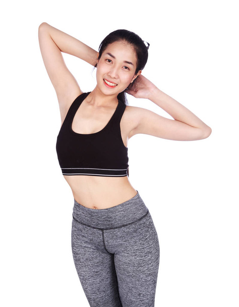 fitness woman stretching the muscles of her arms isolated on whi - Foto, afbeelding