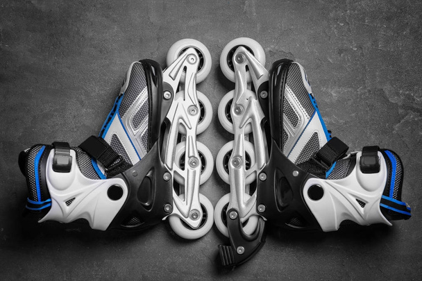 Roller skates on grey background - Foto, imagen