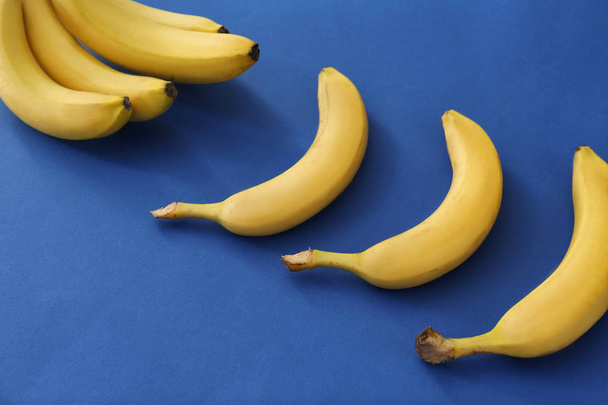 Tasty ripe bananas on color background - Photo, image