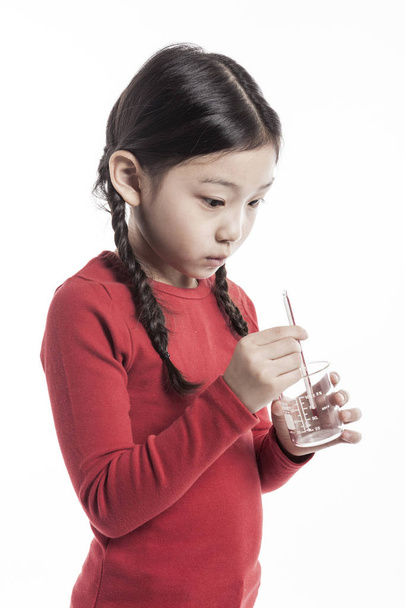 cute Girl making chemical experiments. - Foto, imagen