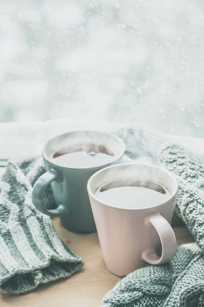 Valentines day concept - two cups of tea in front of snow background - Photo, Image
