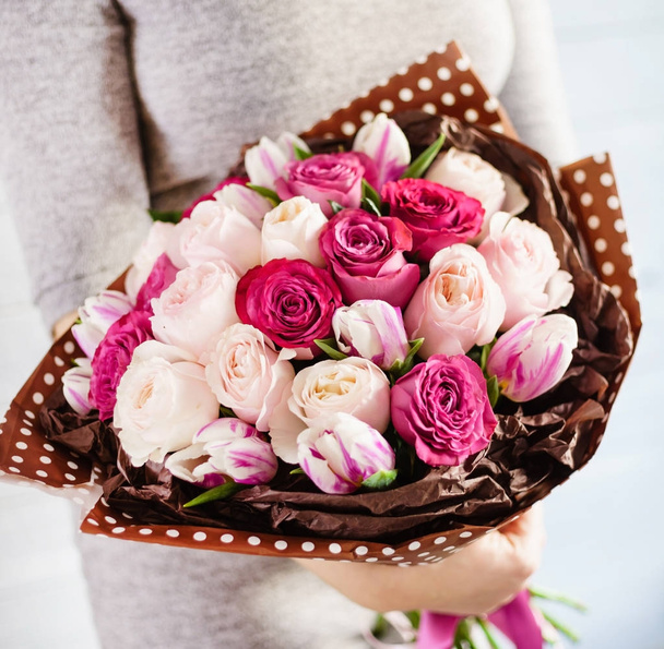 nice bouquet in the hands of woman  - Photo, Image