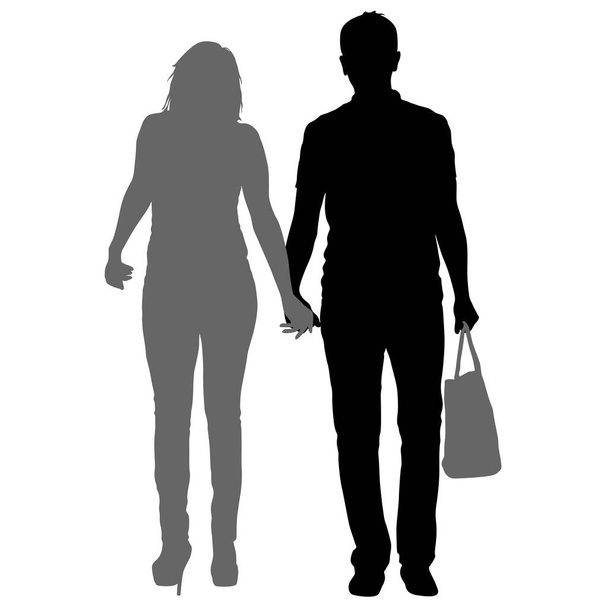 Silhouet man en vrouw lopen hand in hand - Vector, afbeelding